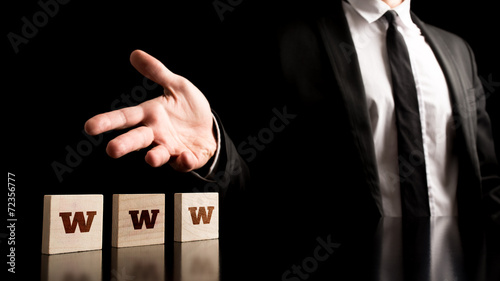 Man Representing Wooden Pieces with WWW Letters