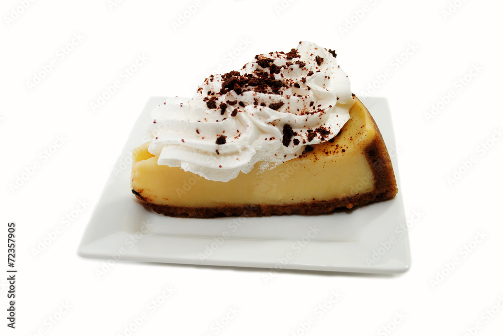 Served Cheesecake with Whipped Cream and Crumbled Chocolate Served Cheesecake with Whipped Cream and Crumbled Chocolate