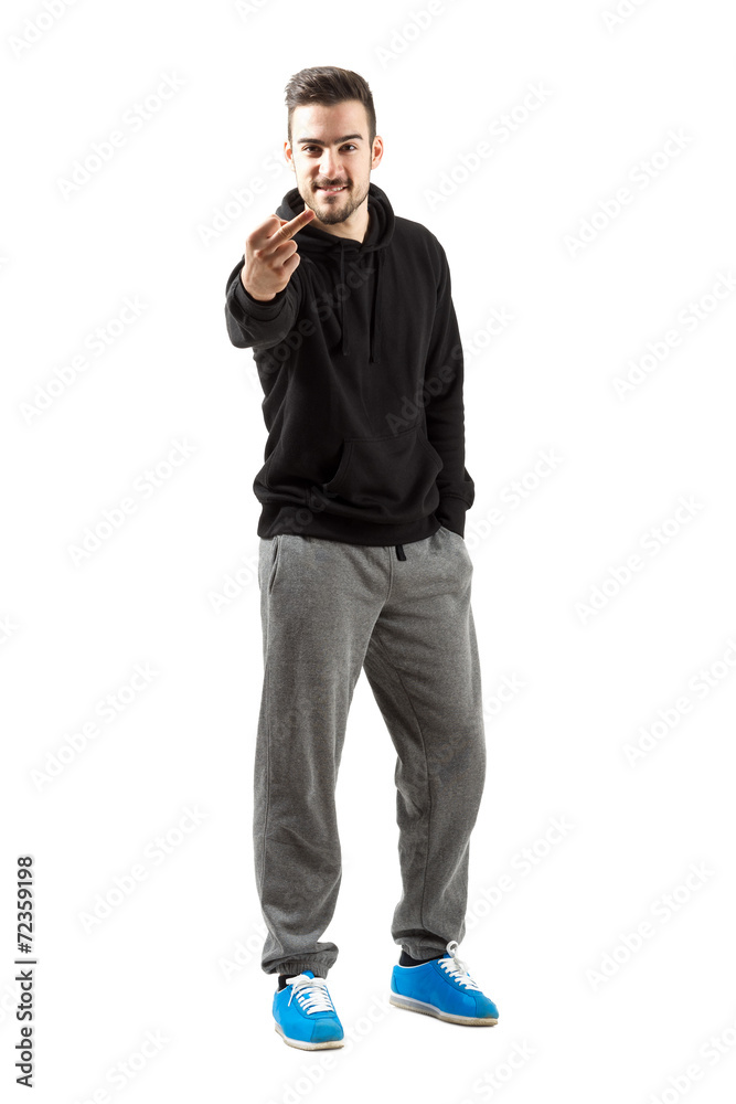 Young man in hoodie with middle finger gesture Young man in hoodie with middle finger gesture