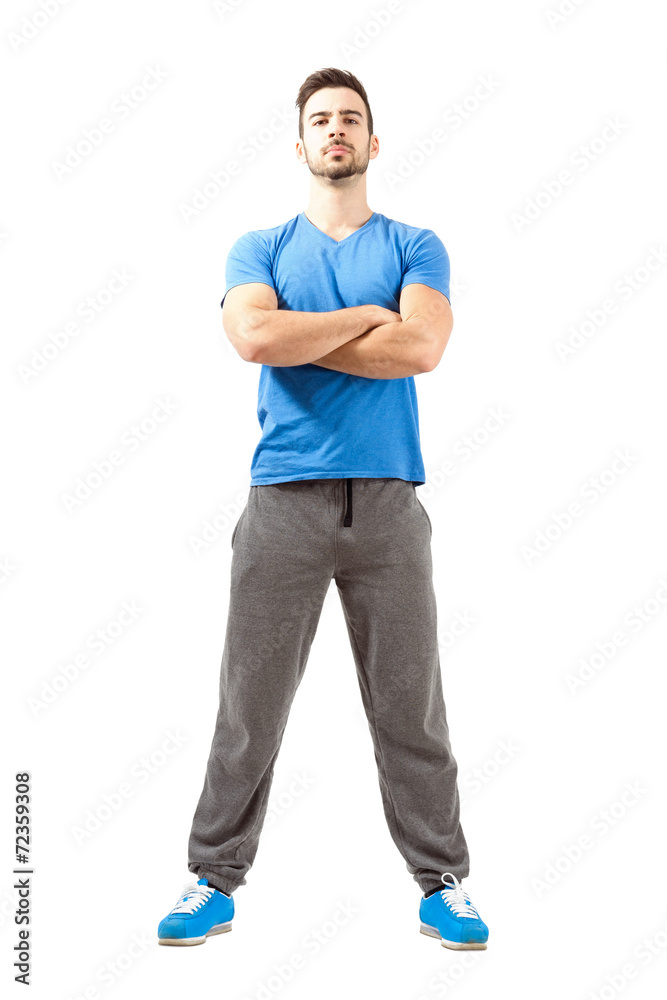 Serious fit guy with crossed hands and head back Serious fit guy with crossed hands and head back
