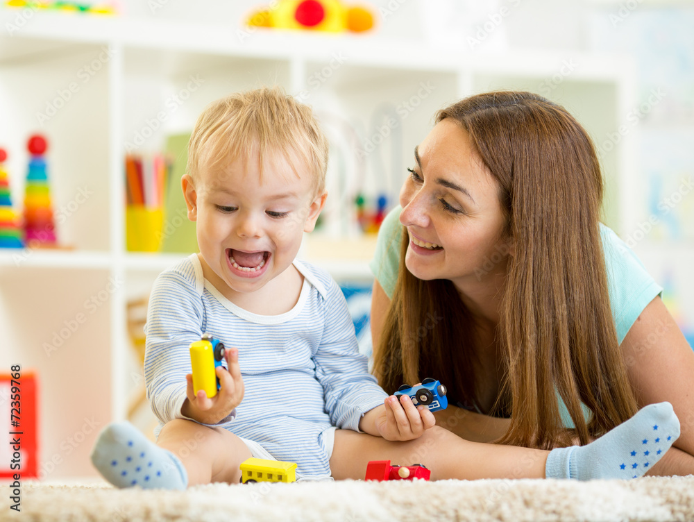 kid boy and mom playing with construction toys indoor kid boy and mom playing with construction toys indoor