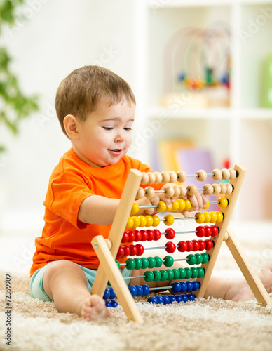 kid boy playing with counter