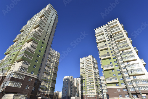 High residential buildings on the background of blue sky
