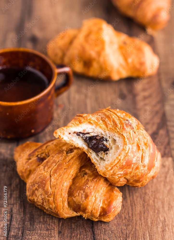 bite croissant with chocolate, french baking