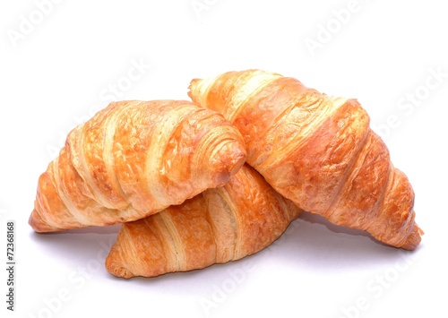 Fresh and tasty croissants isolated on white background