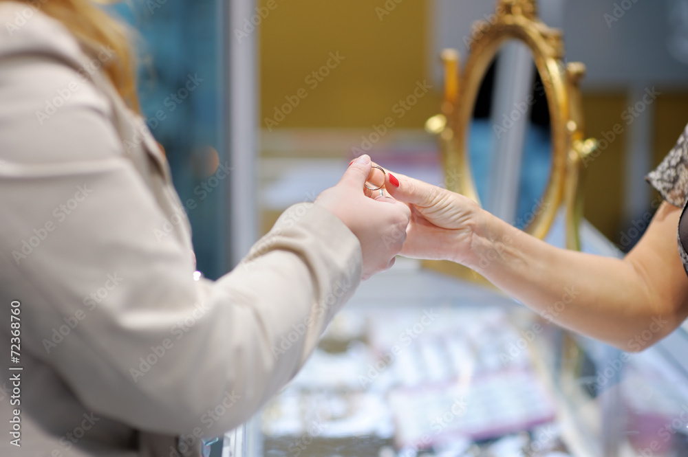 Woman trying wedding rings at a jeweler