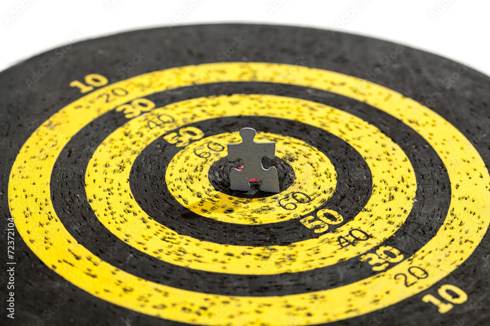 Jigsaw Puzzle Piece on Old Yellow Target Jigsaw Puzzle Piece on Old Yellow Target