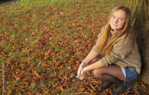 Young pretty girl in autumn park.