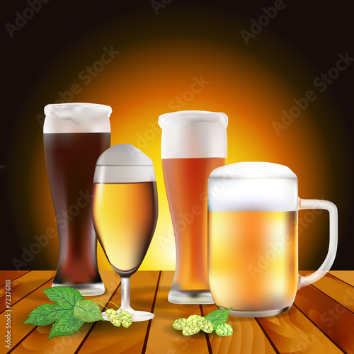 Still life with beers and hops on wooden table