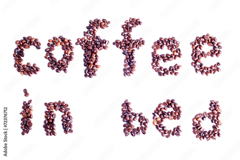 coffee beans laid out in the form of words coffee in bed isolate