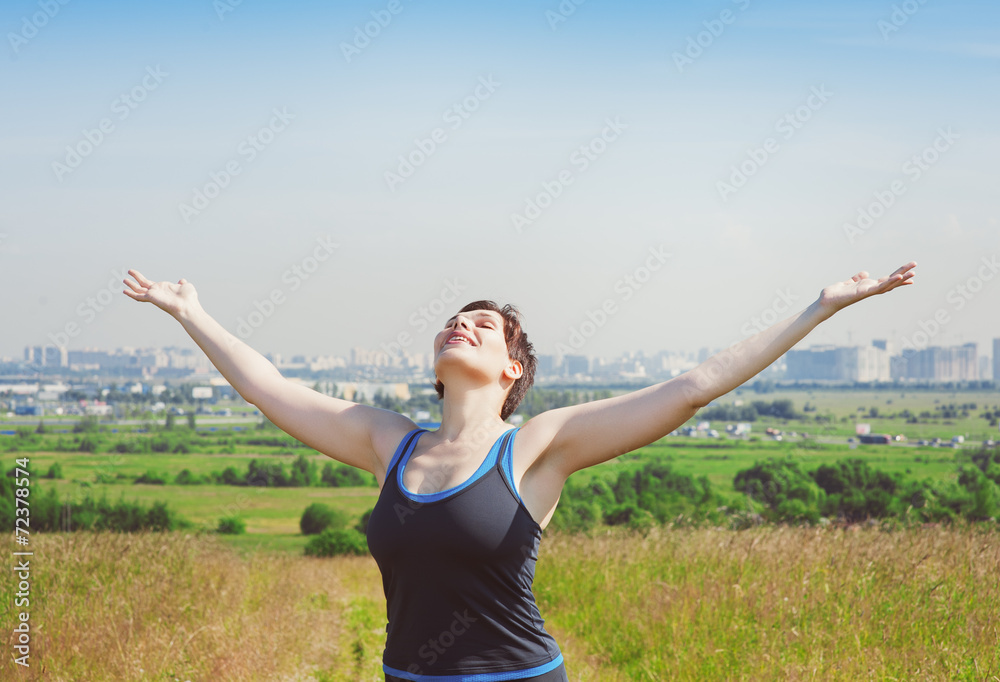 Smiling fitness plus size woman enjoy sunlight Smiling fitness plus size woman enjoy sunlight