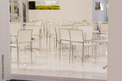 white Table and chair set in empty modern cafe © GioRez