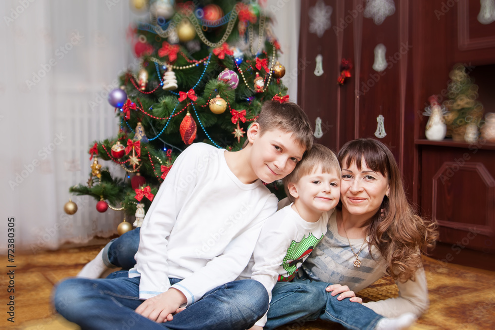 Happy mother and two her sons. Christmas photo Happy mother and two her sons. Christmas photo