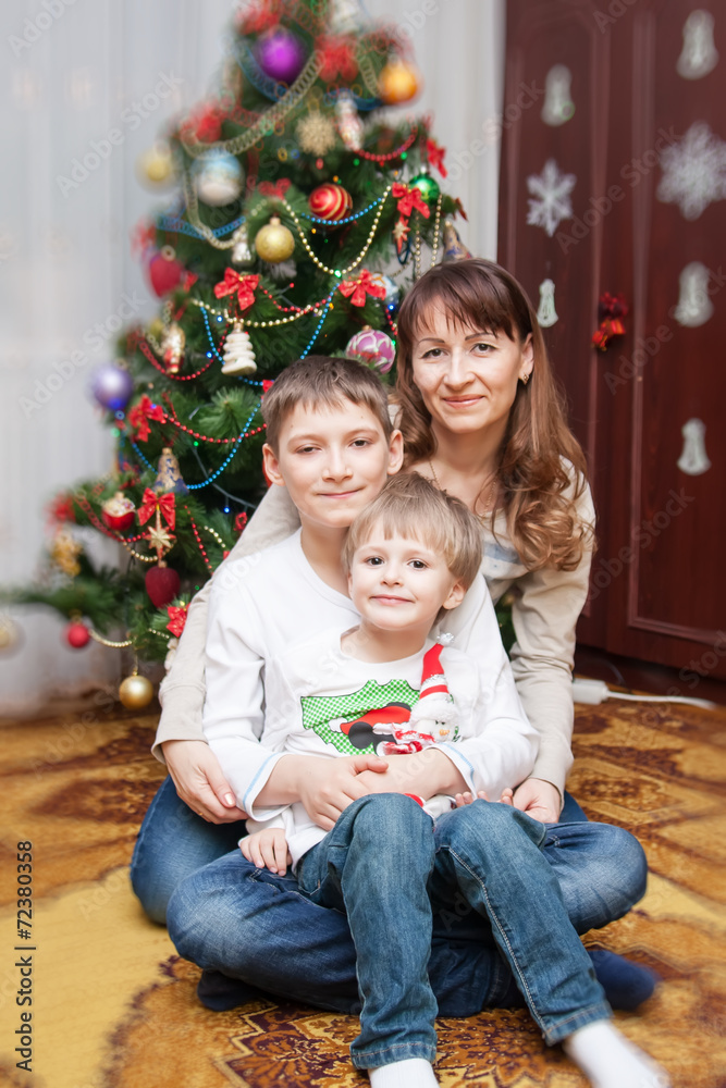 Happy mother and two her sons. Christmas photo Happy mother and two her sons. Christmas photo