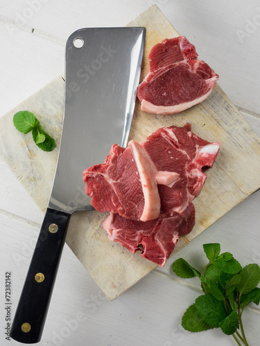 lamb chops with meat cleaver and fresh mint