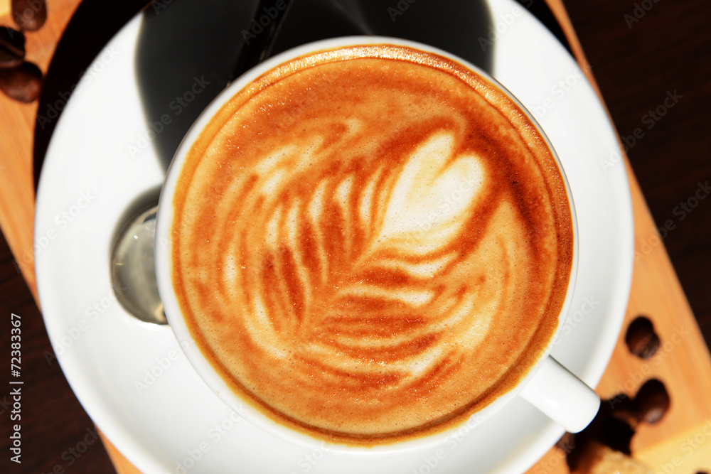 Cup of coffee with cute drawing in cafe Cup of coffee with cute drawing in cafe