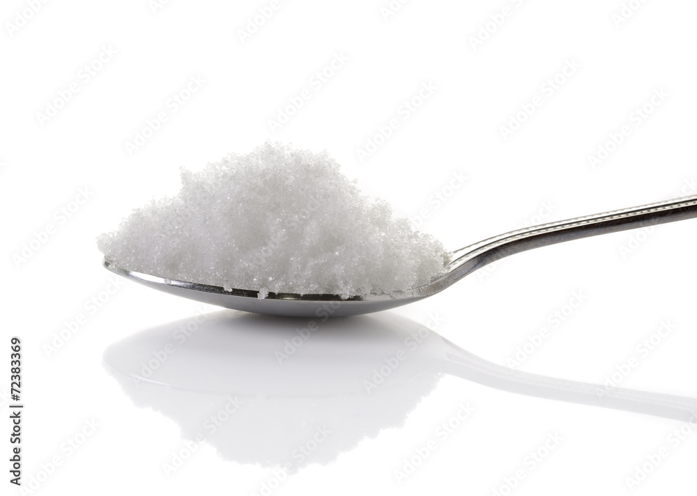 sea salt in spoon on white background sea salt in spoon on white background