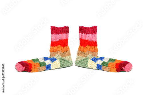 Warm knitted woolen socks knitting needles isolated on a white b