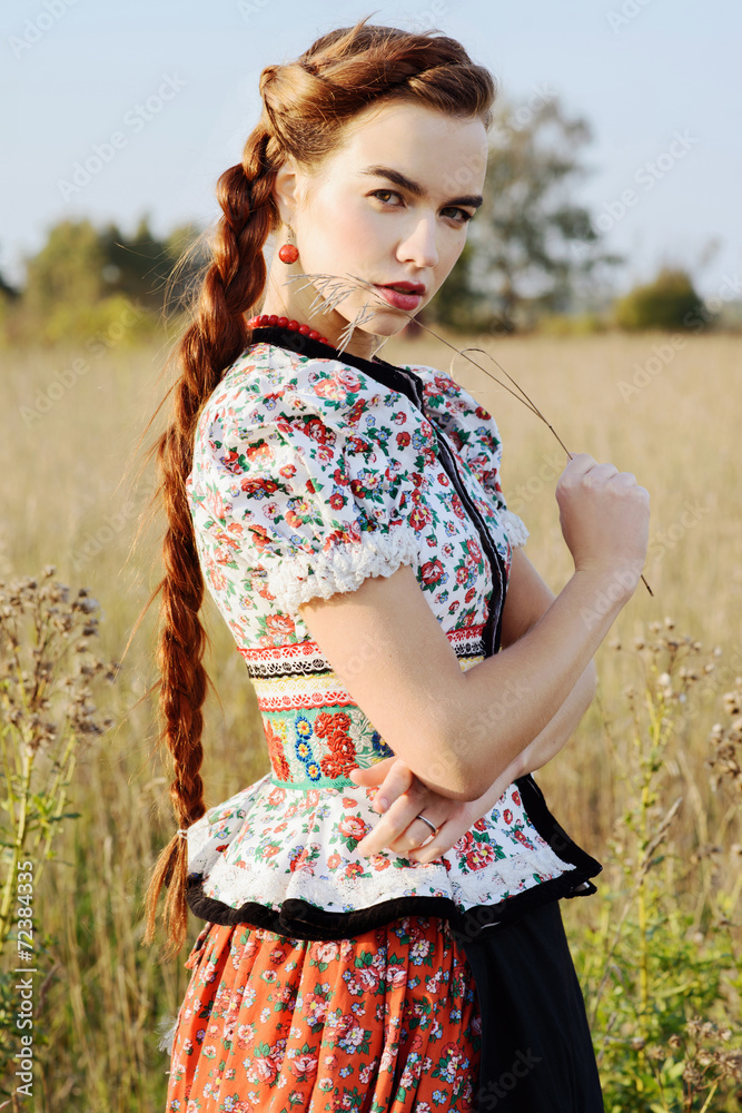 Young peasant woman, dressed in Hungarian national costume Young peasant woman, dressed in Hungarian national costume
