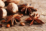 Stars anise with nutmeg on wooden background