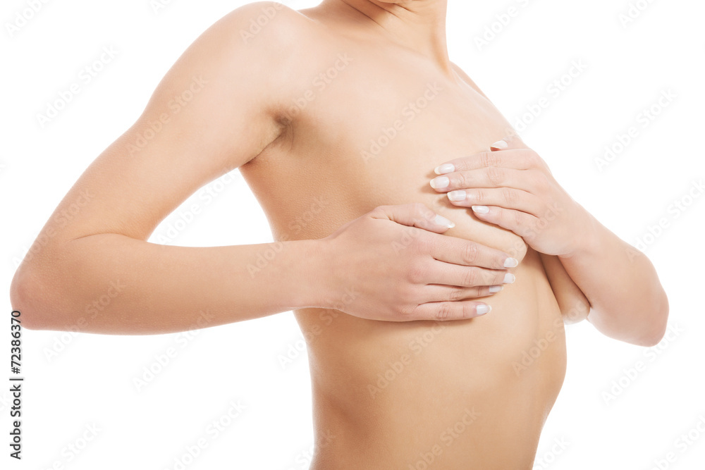 Woman examining her breast