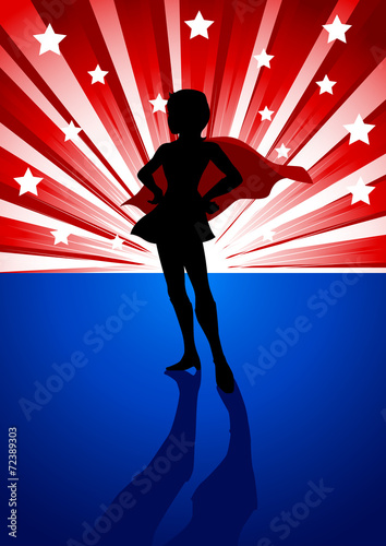 A super heroine standing in front of light burst