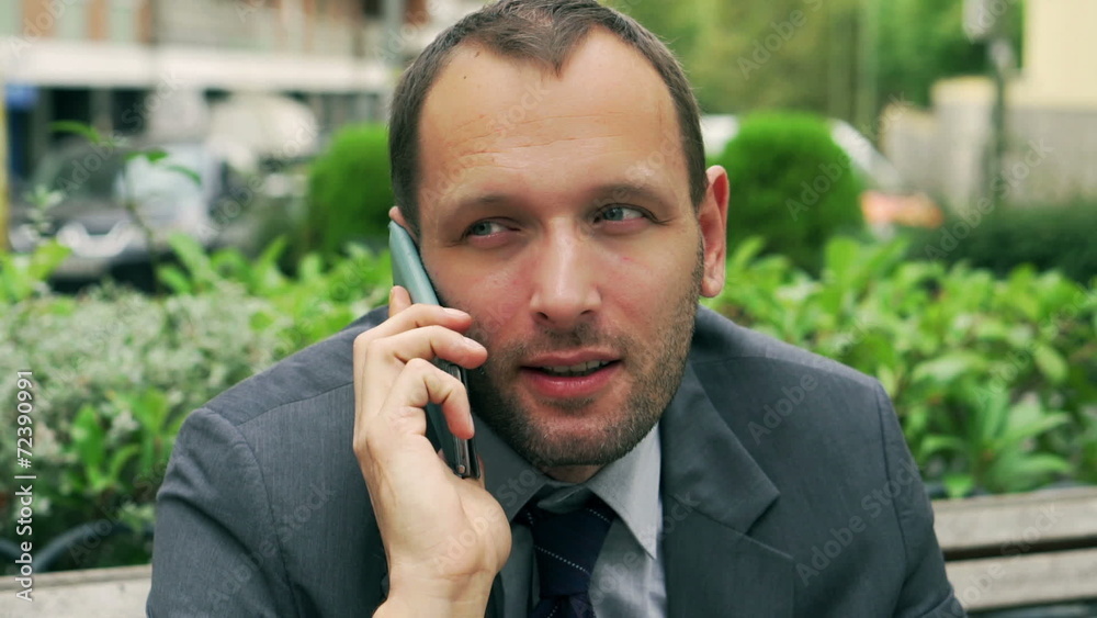 Businessman talking on mobile phone, closeup, steadycam shot Businessman talking on mobile phone, closeup, steadycam shot