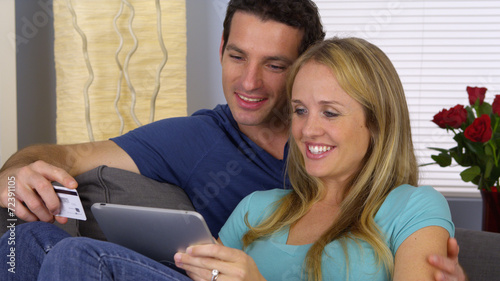 Couple browsing the web on tablet