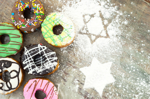 bright donuts on wooden background