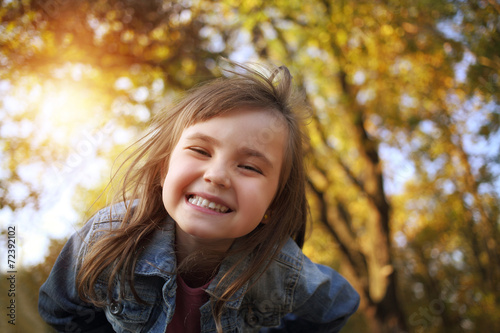 Joyful young girl smile in the sunny park