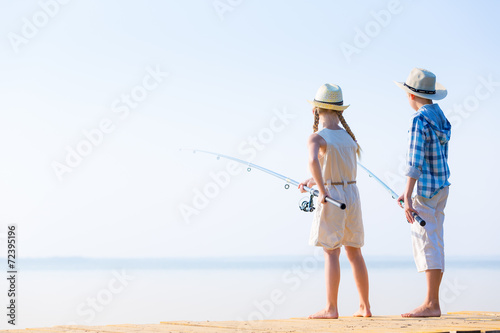 Boy and girl with fishing rods