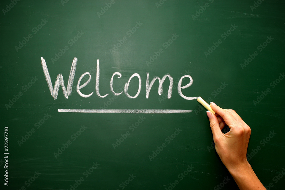 welcome handwritten in script in chalk on a blackboard welcome handwritten in script in chalk on a blackboard