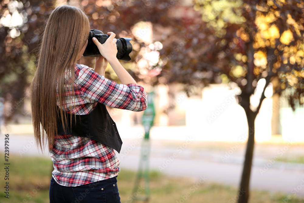 Beautiful young photography take photos outdoors in park Beautiful young photography take photos outdoors in park