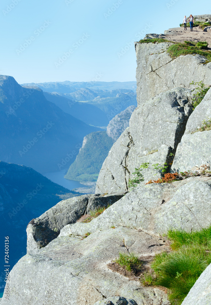 Family on Preikestolen massive cliff top (Norway) Family on Preikestolen massive cliff top (Norway)