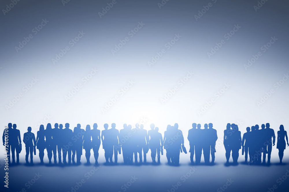 © Photocreo Bednarek - Group of business people silhouettes looking towards light.