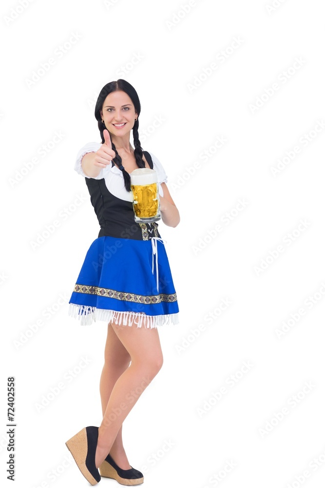 Pretty oktoberfest girl holding beer tankard Pretty oktoberfest girl holding beer tankard