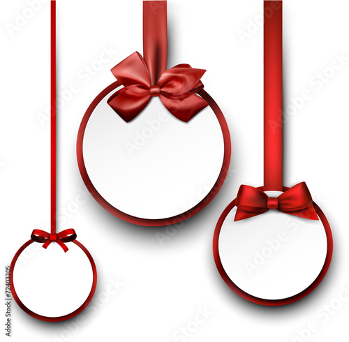 White paper gift cards with red satin bow.