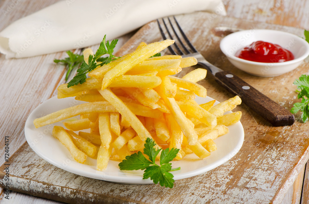  fries on  wooden board