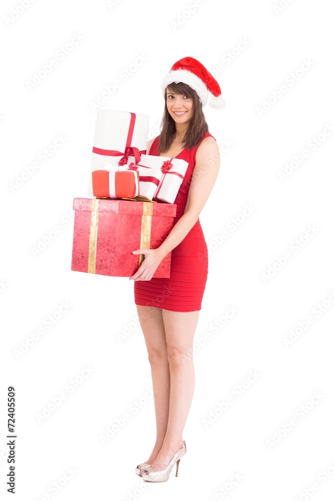 Festive brunette holding pile of gifts Festive brunette holding pile of gifts