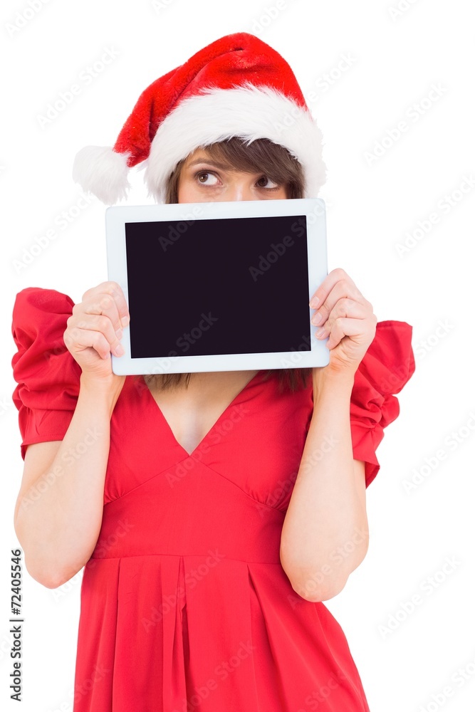 Festive brunette holding a tablet pc Festive brunette holding a tablet pc