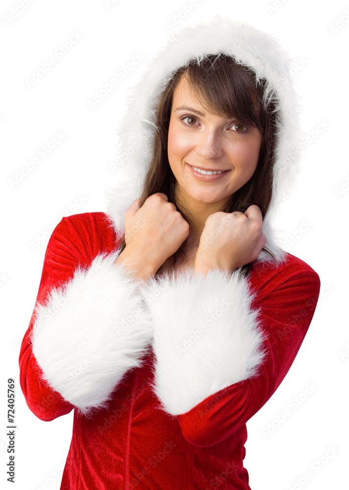 Cute brunette in santa claus smiling at camera Cute brunette in santa claus smiling at camera