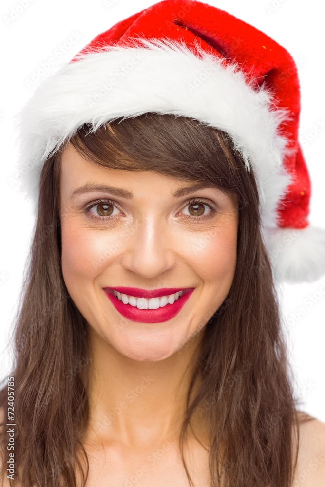 Portrait of pretty young woman in santa costume smiling Portrait of pretty young woman in santa costume smiling