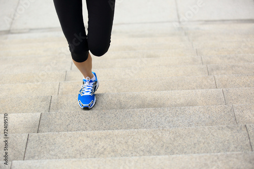 Runner athlete  legs running on stairs