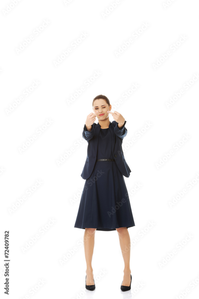 Fototapeta premium Businesswoman gesturing by middle fingers
