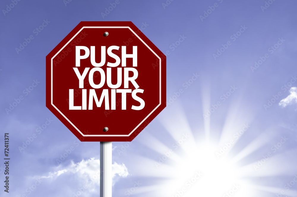 Push your Limits written on red road sign Push your Limits written on red road sign