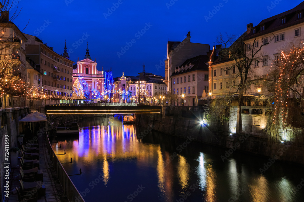 View of Ljubljanica river in old center decorated for Christmas