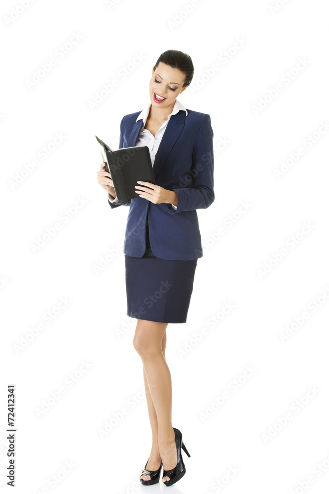 Businesswoman reading a note