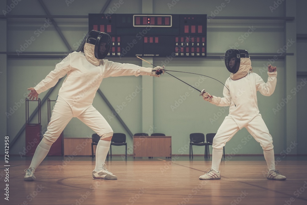 Little girl fencer and her trainer