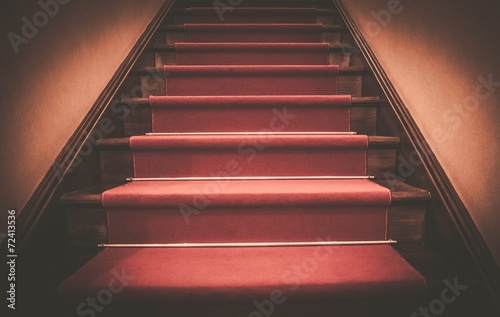 Red carpet on wooden steps