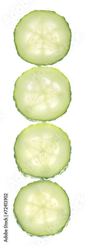 Transparent vertical cucumber slice isolated on white